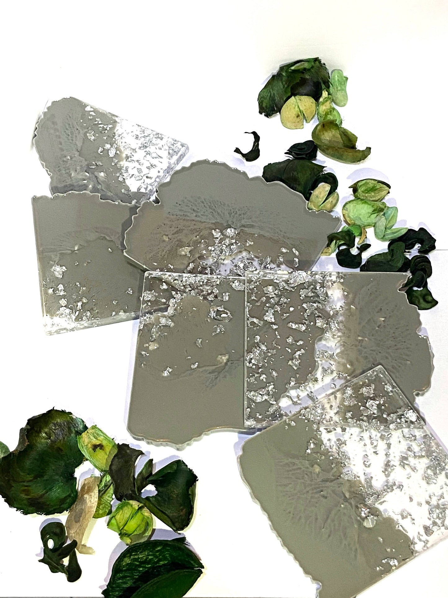 Close-up of handmade grey and silver square resin coaster