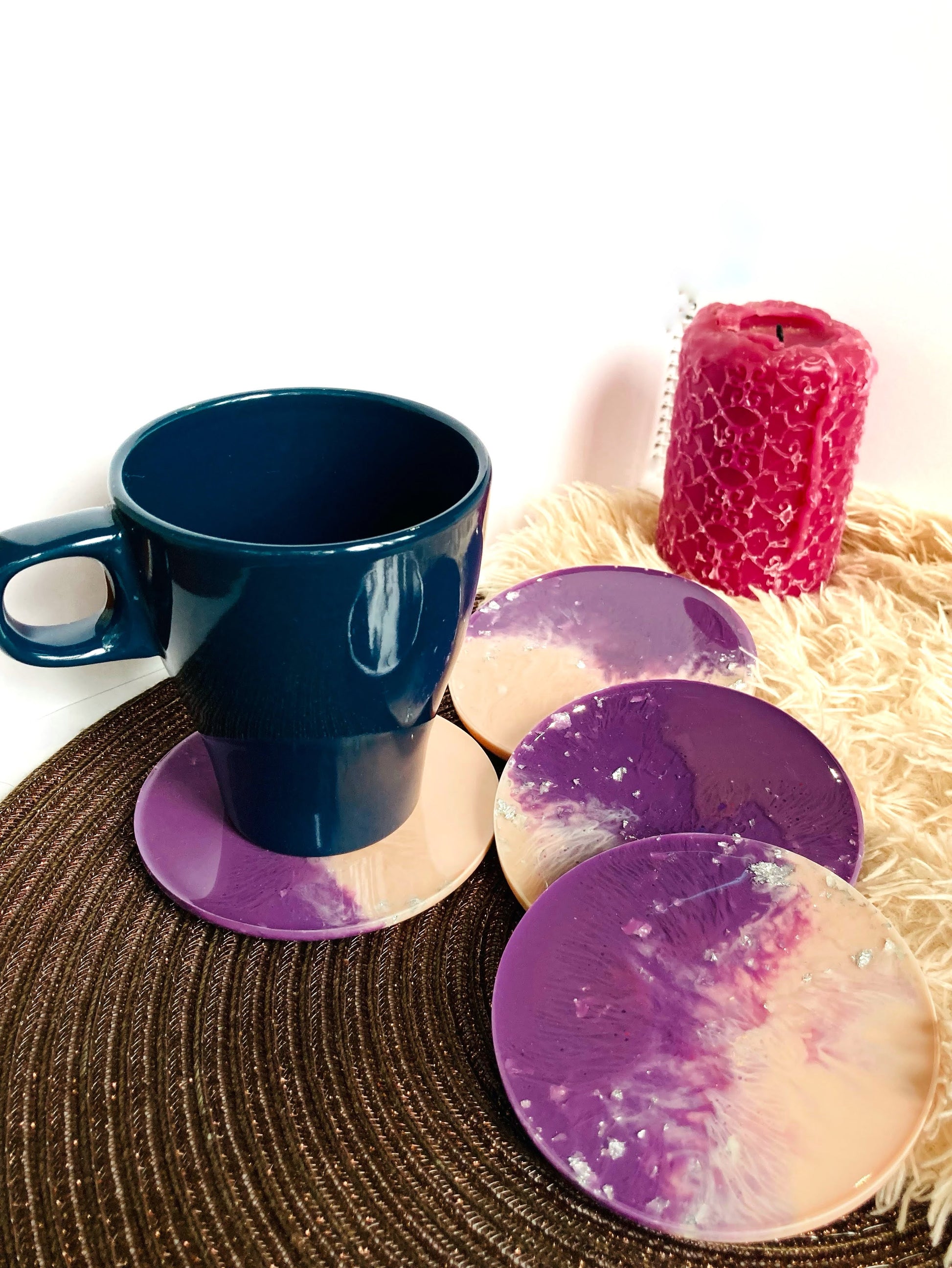 Pink and purple round resin coaster set detail shot