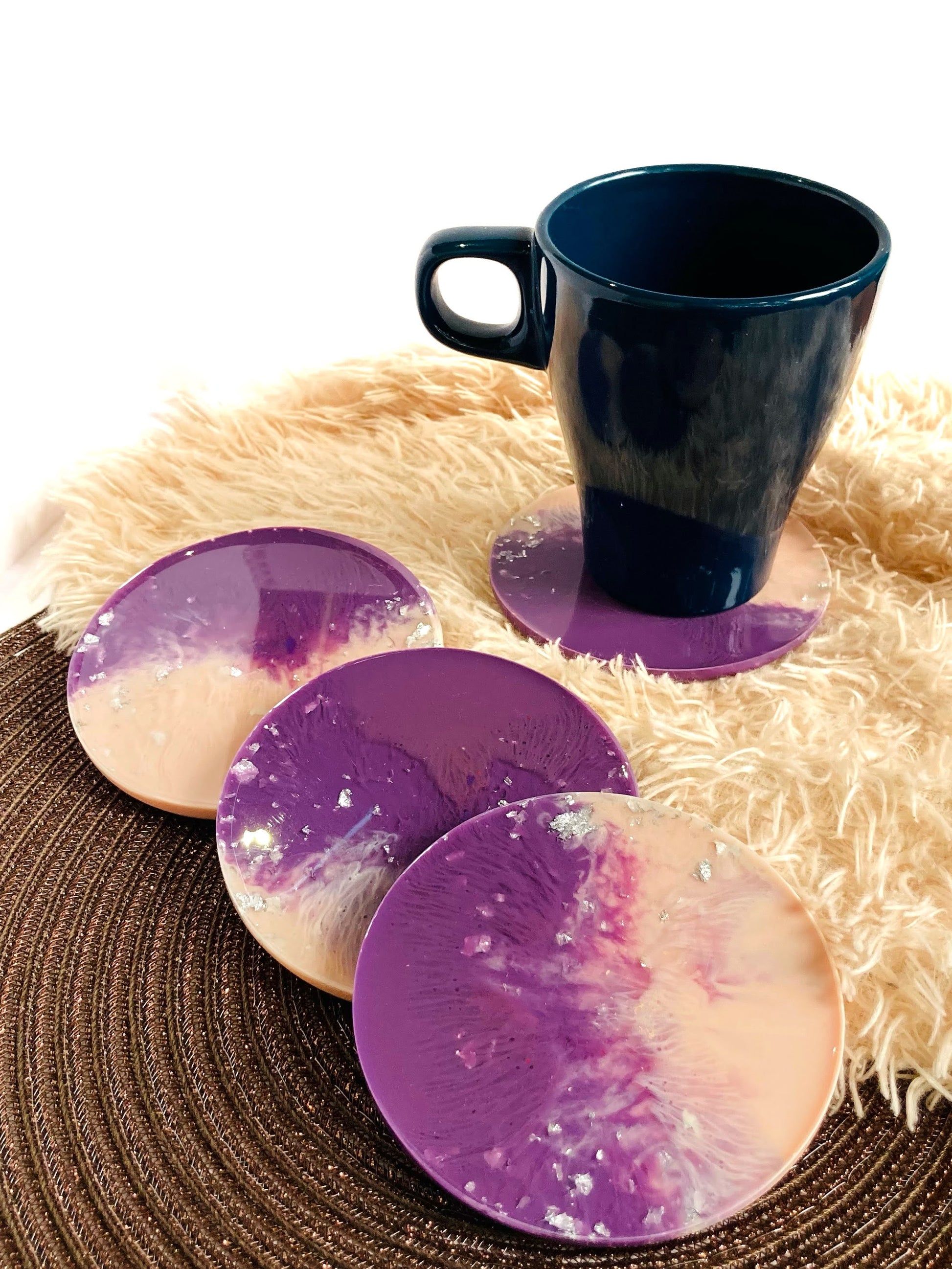 Close-up of pink purple handmade round resin coaster